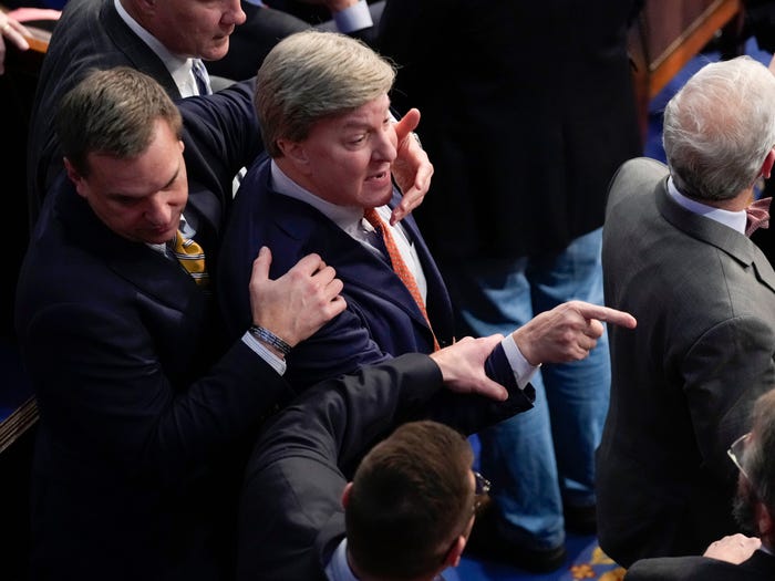 Rep. Richard Hudson, R-N.C., left, pulls Rep. Mike Rogers, R-Ala., back as they talk with Rep. Matt Gaetz, R-Fla., and other during the 14th round of voting for speaker as the House meets for the fourth day to try and elect a speaker and convene the 118th Congress in Washington, Friday, Jan. 6, 2023.