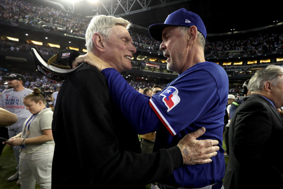 Bochy and Rangers owner Ray Davis celebrate winning the World Series. (Harry How/Getty Images
