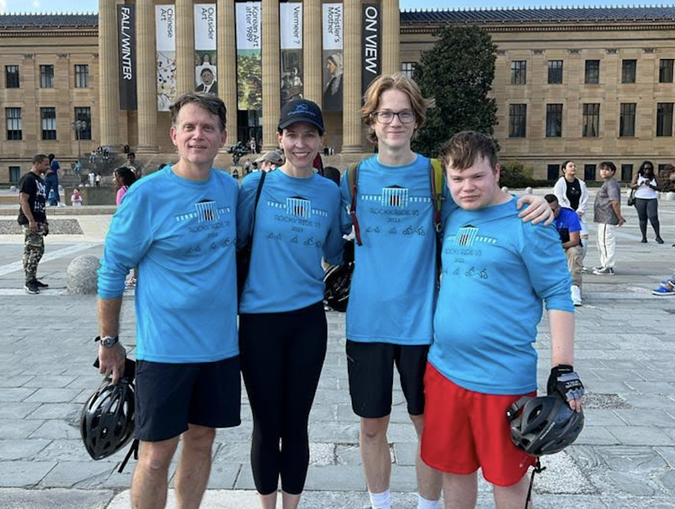 From left: Tim Ogden (dad), Dr. Erica Davis (stepmom), Jackson (younger brother), and Nathanael (young man with BBS) at the end of the 2023 Rocky Ride. (Tim Ogden)