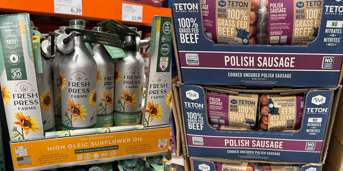 Photo of Costco display of Frsh Press farms sunflower oil containers next to image of Teton Polish sausage display