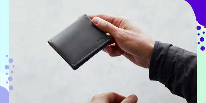 A model holds the Bellroy Slim Sleeve Wallet.