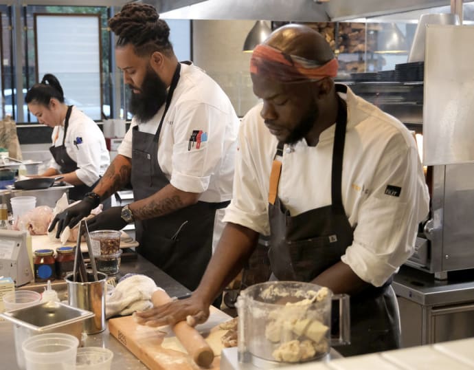 Photo still of Kaleena Bliss, Valentine Howell Jr, and Charly Pierre in Top Chef