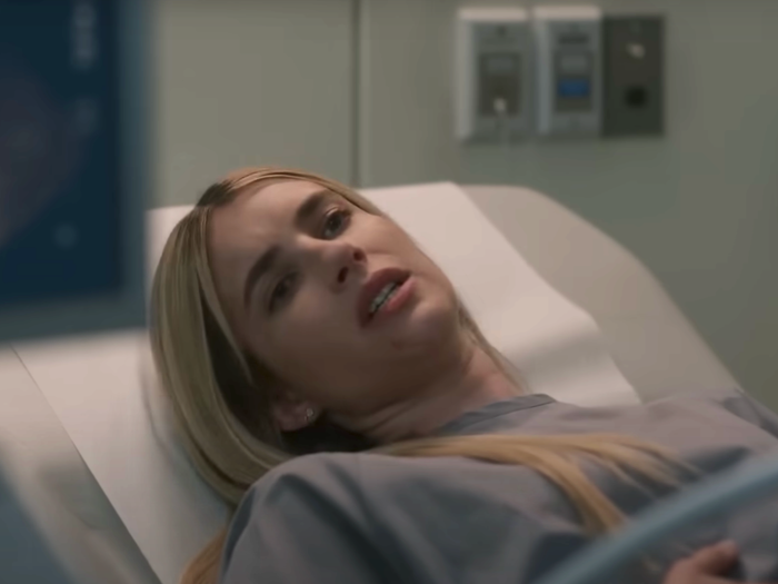 Emma Roberts as Anna, lying on a bed with a baby scan in shot