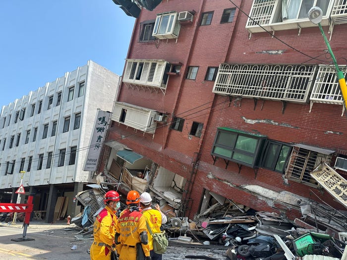 Firefighters work at the site where a building collapsed following the earthquake, in Hualien, Taiwan, in this handout provided by Taiwan's National Fire Agency on April 3, 2024.