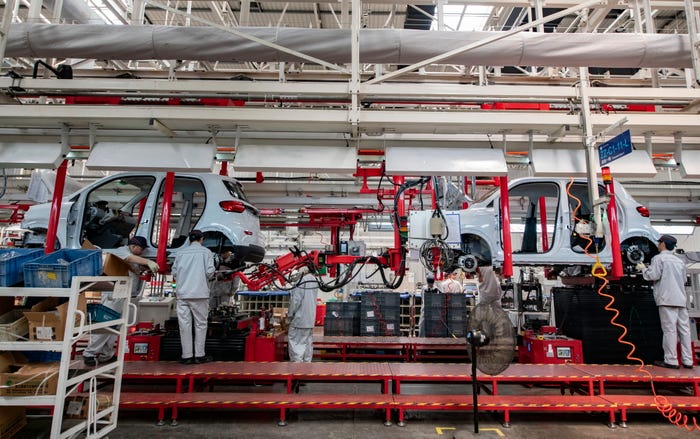 Employees work on the assembly line of new energy vehicles at a factory of Chinese EV startup Leapmotor on April 1, 2024 in Jinhua, Zhejiang Province of China.