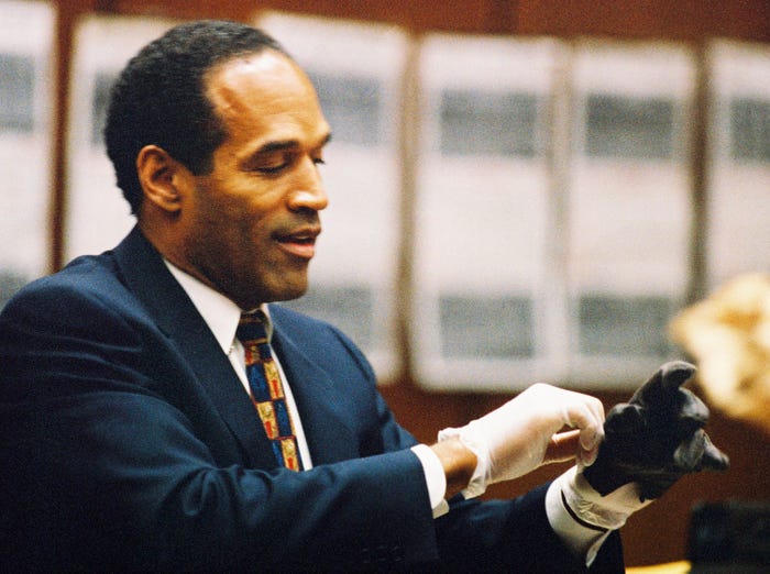 OJ Simpson tries on a leather glove during his trial