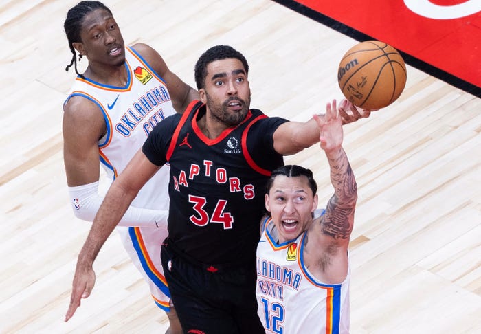 Jontay Porter of Toronto Raptors fights for a rebound with Lindy Waters III R of Oklahoma City Thunder during the 2023-2024 NBA regular season game between Toronto Raptors and Oklahoma City Thunder in Toronto, Canada, March 22, 2024. ()