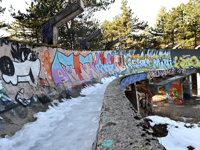 The partially dismantled bobsleigh track which was damaged during past conflicts lies abandoned on Mount Trevevic, near Sarajevo on February 6, 2024, as Sarajevo begins marking the 40th anniversary of the XIV Winter Olympics.