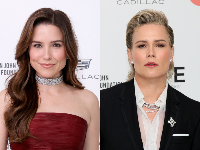 left: sophia bush, wearing a strapless red gown and thick silver choker necklace, her hair worn in soft curls, smiling; right: ashlyn harris in a sheer white shirt and black suit jacket, with silver jewelry and her hair worn pushed back from her forehead