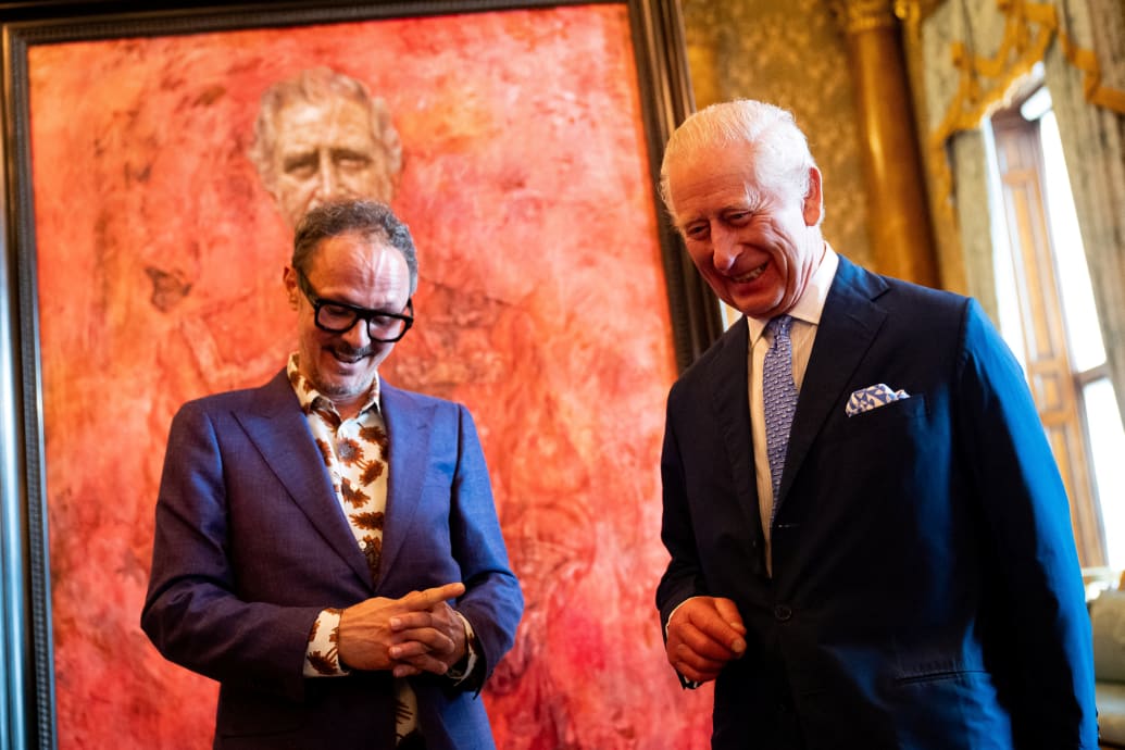 King Charles meets with artist Jonathan Yeo next to a portrait of the king, at Buckingham Palace, London, Britain May 14, 2024.