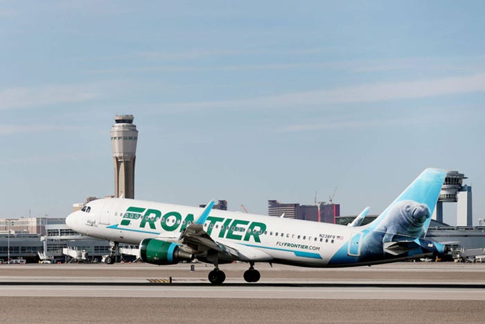 A Frontier Airlines plane lands at the McCarran International Airport in Las Vegas on Thursday, Feb. 27, 2020.
