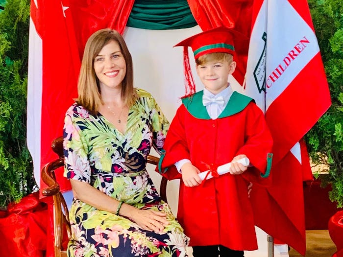 Mother and young son at a kindergarten graduation