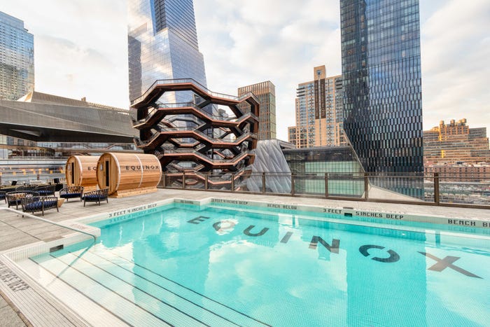 Photo of a rooftop pool at an Equinox health club.