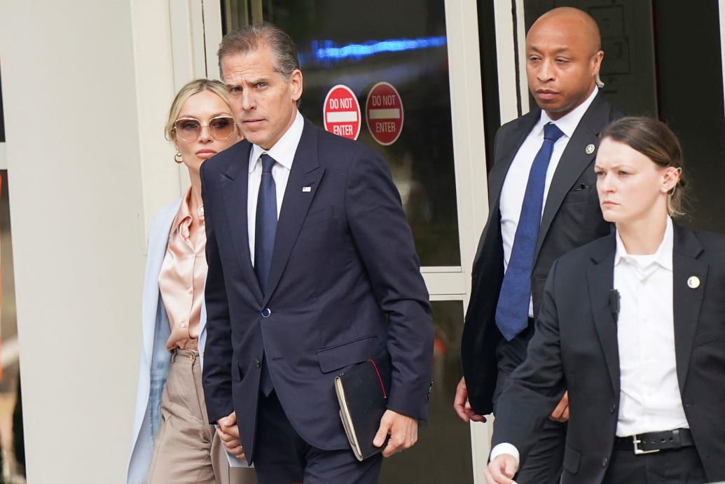 Hunter Biden leaves federal court with his wife Melissa Cohen Biden.