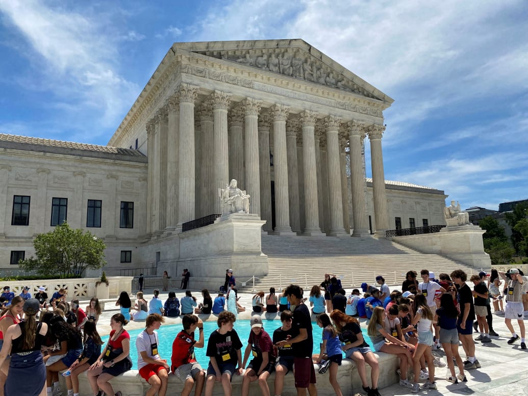 A general view of the U.S. Supreme Court building, with members of a student group in the foreground, in Washington, U.S., June 1, 2024.