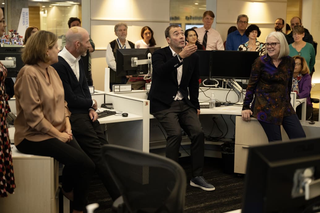 Will Lewis wears his $1,100 calfskin-and-suede Zegna sneakers while speaking to staff at The Washington Post.