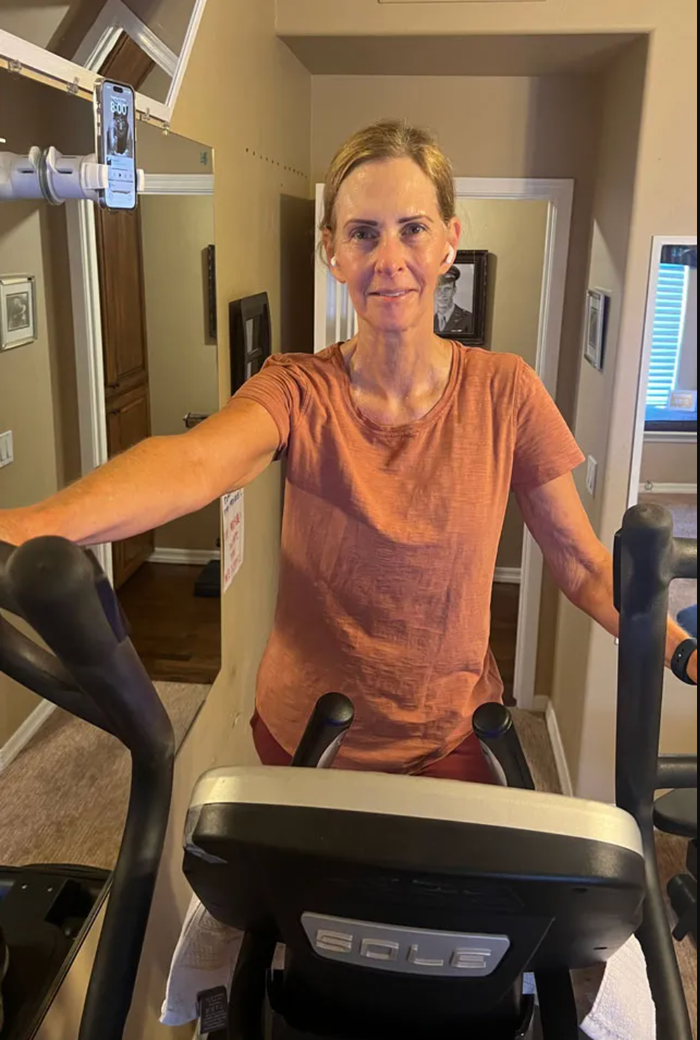 A woman on an elliptical.