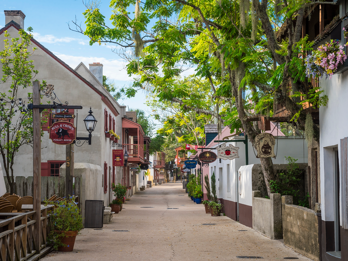 A pedestrianized street lined with shops and attractions in the Historic District of St. Augustine