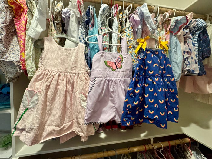 Outfits hanging up in Elliott Harrell's kids' closet.