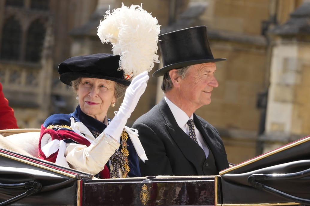 Princess Anne and her husband Timothy Lawrence ride in a carriage after attending the Order of the Garter service at Windsor Castle on June 17, 2024 in Windsor, England.