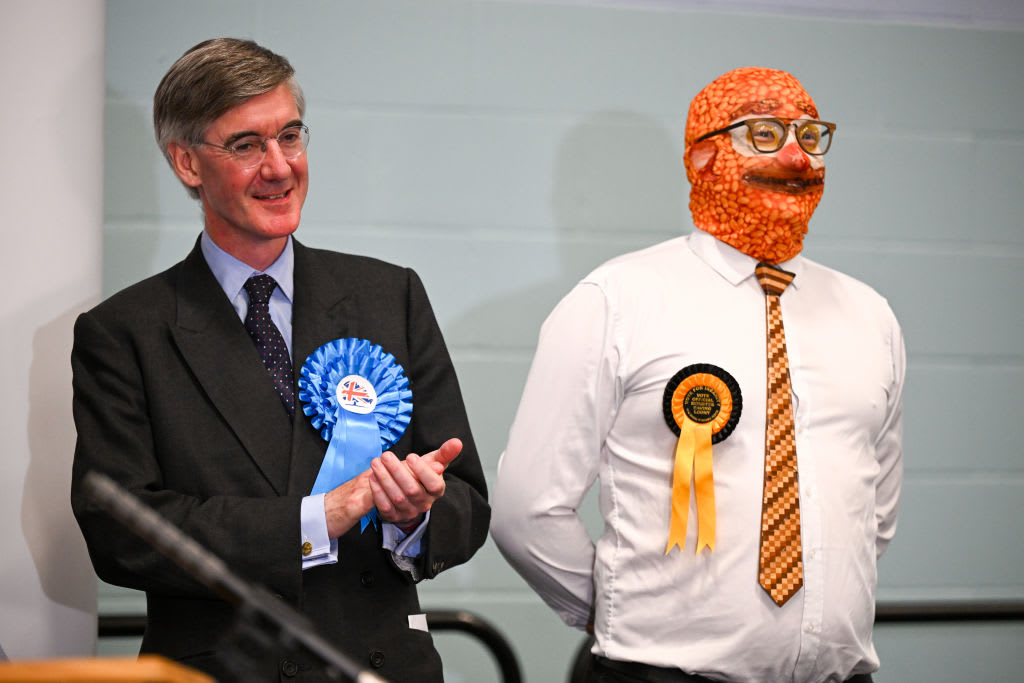 Conservative candidate Jacob Rees-Mogg stands next to Barmy Brunch from The Official Monster Raving Loony Party during the declaration for the North East Somerset constituency.